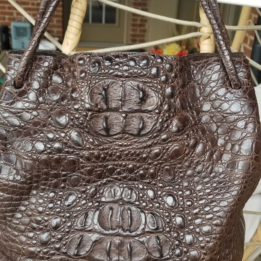Women's brown bag made of genuine crocodile leather